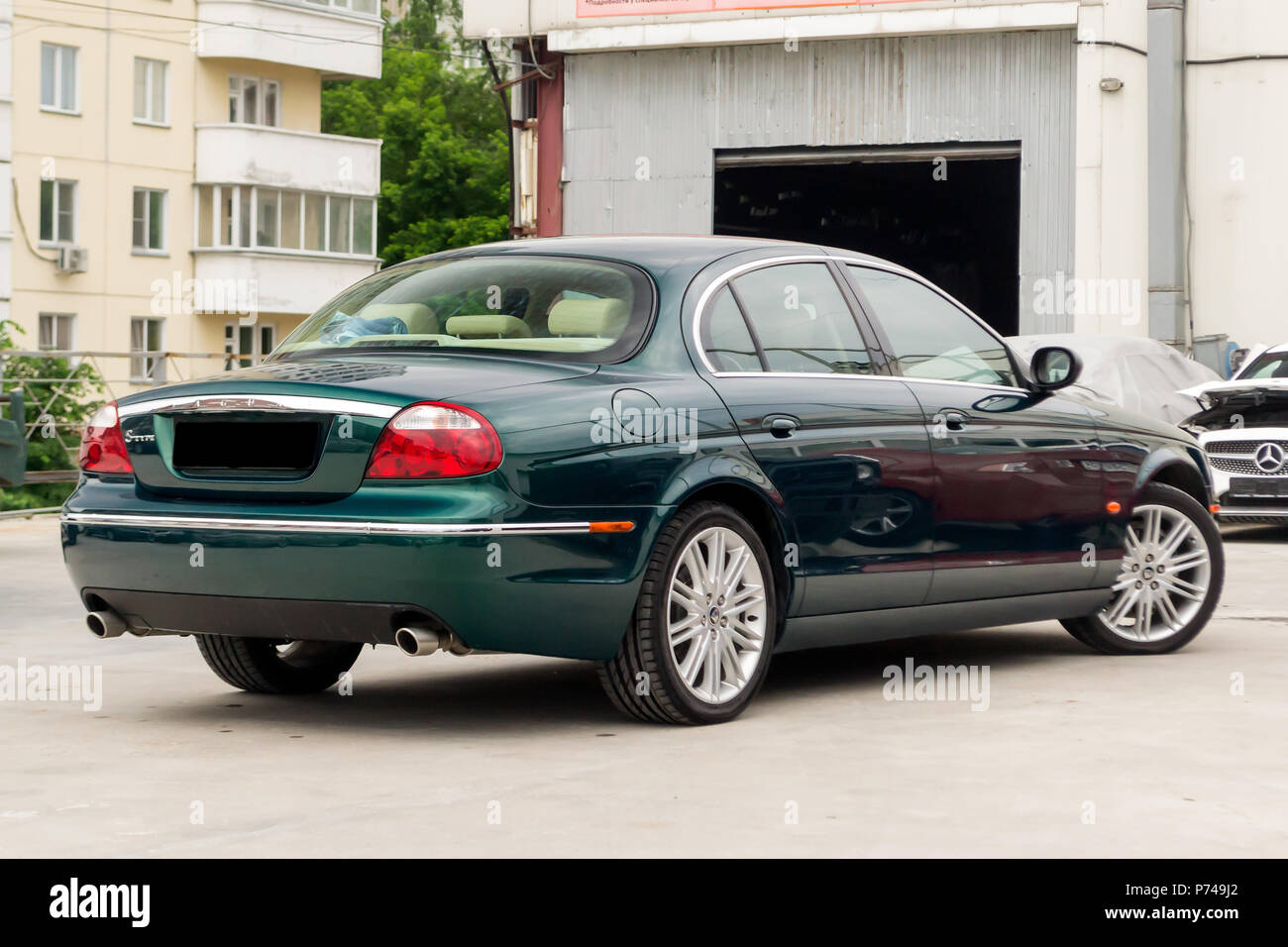Novosibirsk, Russia - 06.28.2018: Brightly green Jaguar S-type 2007 rear  view with light beige interior in excellent condition in a parking space  amon Stock Photo - Alamy