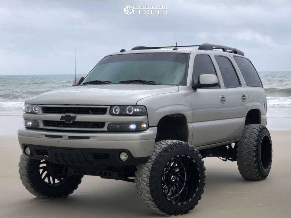 2004 Chevrolet Tahoe with 22x14 -76 TIS 544BM and 37/13.5R22 Super Swamper  Ss-m16 and Suspension Lift 6" & Body 3" | Custom Offsets