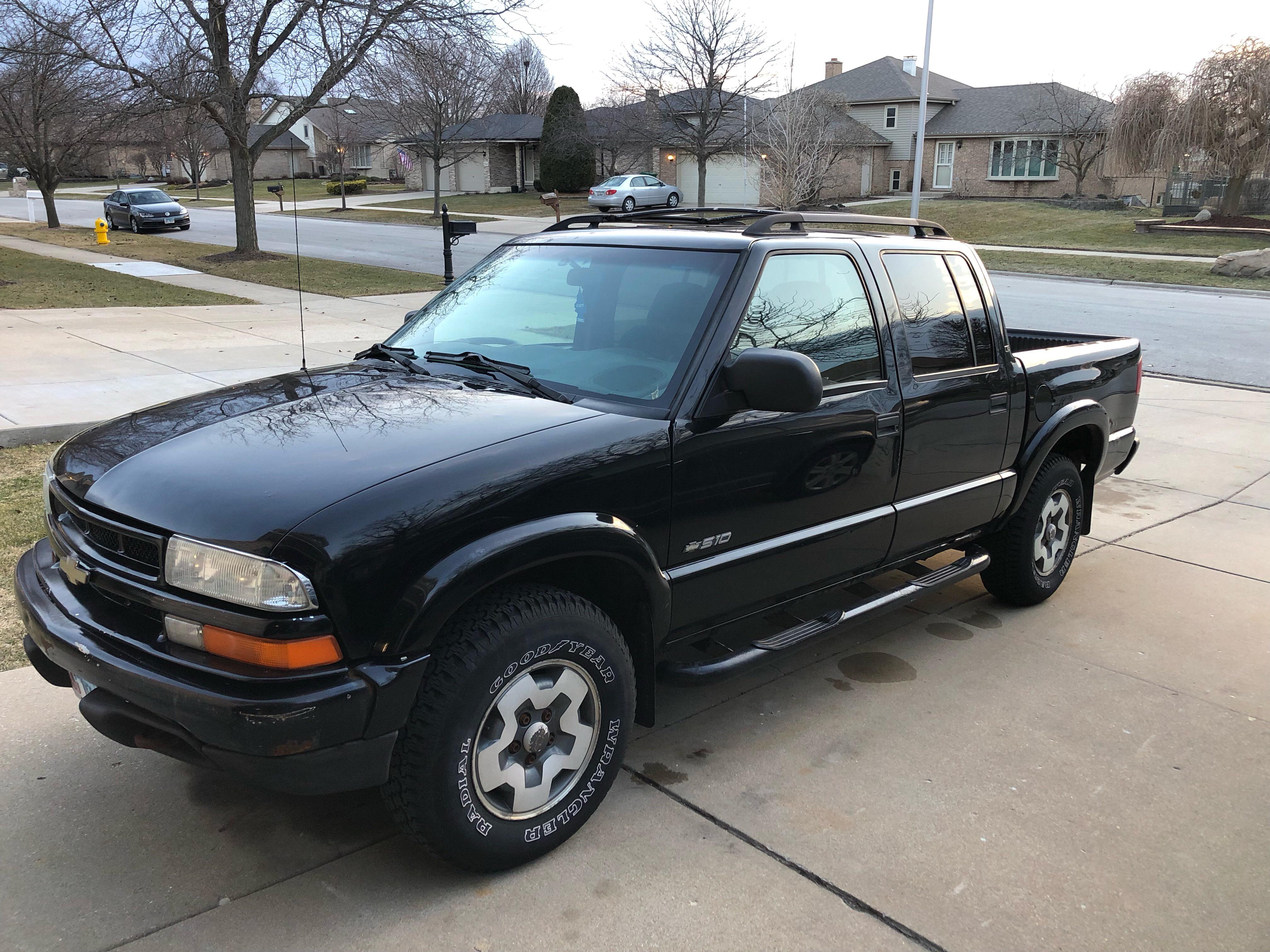 My first truck. 2002 chevy s10 crew cab bought from my neighbor for $500.  350 in parts and a drained gas tank later and it's running great. Got some  rust and some
