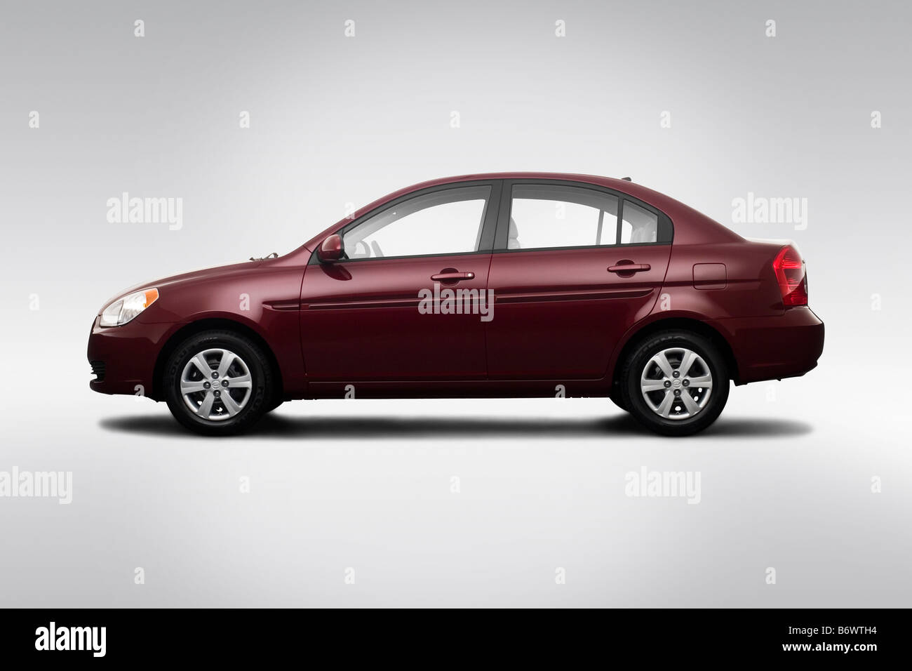 2009 Hyundai Accent GLS in Red - Drivers Side Profile Stock Photo - Alamy