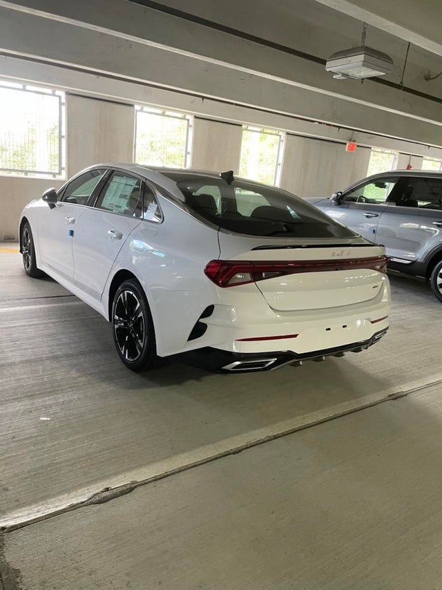 New Kia K5 2023. Dealer just got one in and sent me the pics, they said no  major changes to the vehicle or digital dash unfortunately. Still a great  looking car. :